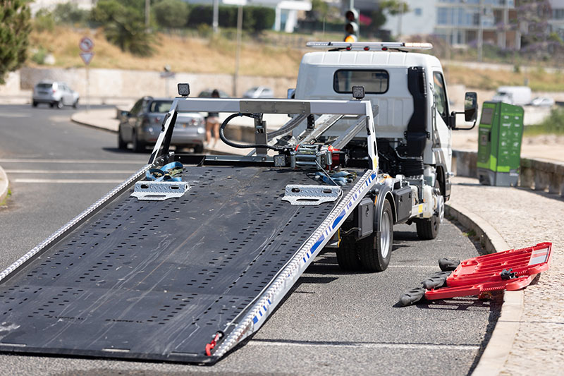 Empty tow truck picking up broken down vehicles in Los Angeles